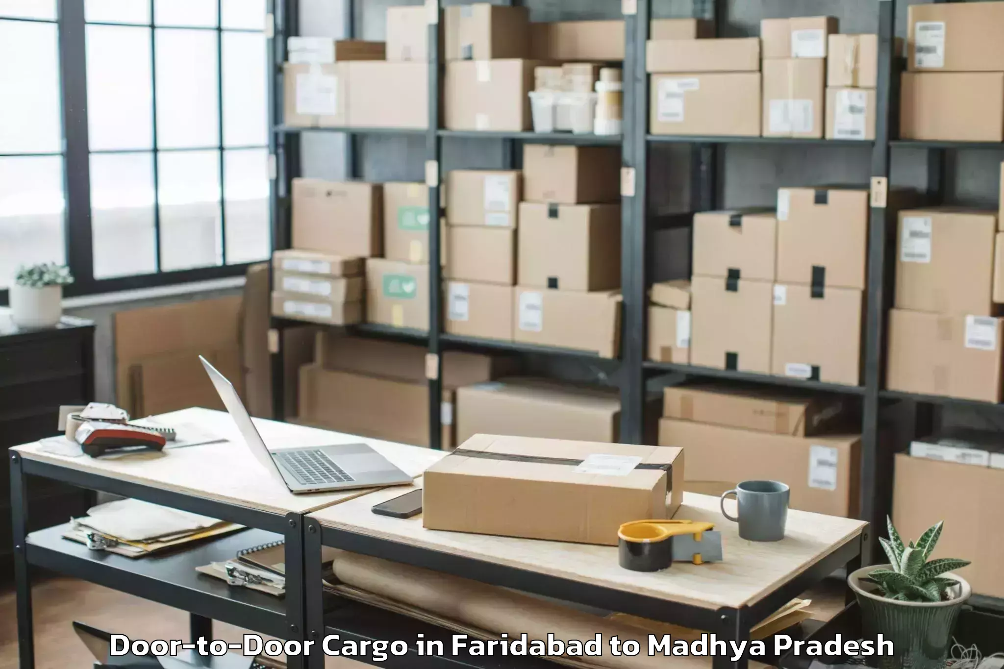 Affordable Faridabad to Khurai Door To Door Cargo